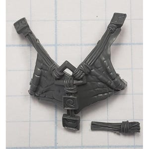 May include: A gray plastic miniature model component, possibly for a tabletop game. The piece features a textured, wing-like structure with intricate details, including rope-like elements and rectangular accents. A separate bundle of rope is also included.