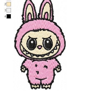 May include: Embroidered design of a pink monster with large eyes, a toothy grin, and bunny-like ears. The design is outlined in black and has a light beige face. The text "labubu.dst" is at the bottom. The design measures 1.87" x 3.36".