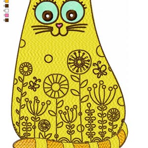 May include: Yellow embroidered cat design with floral and butterfly accents. The cat has large teal eyes, brown pupils, and a pink nose. The design includes the text "cat flower.dst" and measures 13.7 x 20.2 cm.