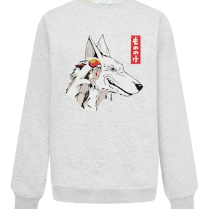 May include: A light grey sweatshirt with a graphic of a white wolf and a woman with a red headdress. The wolf's head is detailed with black outlines. The Japanese text "もののけ" is in a red rectangle on the right side.