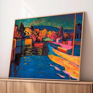 May include: Abstract landscape painting featuring a vibrant harbor scene. The artwork showcases boats with yellow and pink hues, set against a backdrop of colorful trees and a deep blue body of water. The painting is framed in a light wood.
