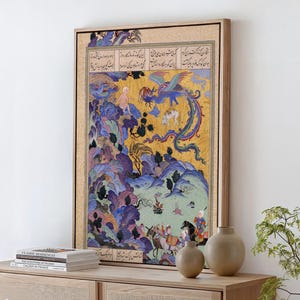 May include: A framed rectangular wall art print featuring a detailed Persian miniature painting. The artwork displays a vibrant landscape with purple and blue stylized mountains, a golden sky, a mythical bird, and figures on horseback with Persian script.