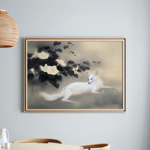 May include: A framed artwork featuring a white fox in a serene, Japanese-inspired style. The fox is depicted with a long, flowing tail, set against a soft, muted background. The artwork includes dark foliage and white flowers, creating a balanced composition.