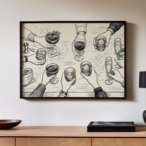 May include: Black and white illustration of a group of hands holding various cocktails and drinks, including a martini, wine, and champagne flutes. The artwork is framed in a black border and mounted on a wall.