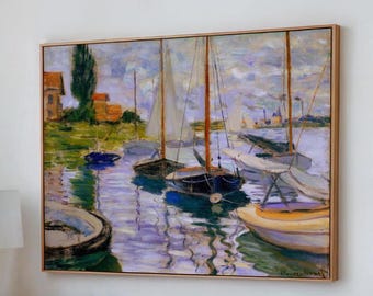 May include: A framed painting of a harbor scene with sailboats, buildings, and water reflections. The artwork features a muted color palette with shades of blue, green, and brown. The painting is in a wooden frame.