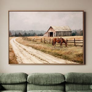 May include: A framed landscape painting depicting a dirt path leading toward a weathered wooden barn under a cloudy sky. A brown horse wearing a saddle grazes in a field enclosed by a wooden fence, with a forest line visible in the background.