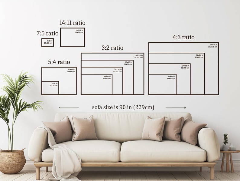 May include: A wall art size guide displaying various rectangular frame ratios including 7:5, 14:11, 5:4, 3:2, and 4:3 with specific dimensions in inches and centimeters. The graphic is positioned above a beige sofa measuring 90 inches wide.
