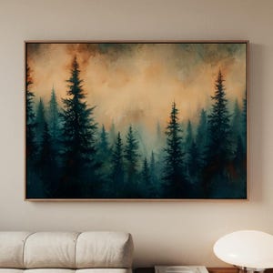 May include: A framed landscape painting depicts a forest of tall, dark green pine trees under a hazy, orange-toned sky. The artwork has a moody, atmospheric quality, with soft brushstrokes and a sense of depth. The painting is in a wooden frame.