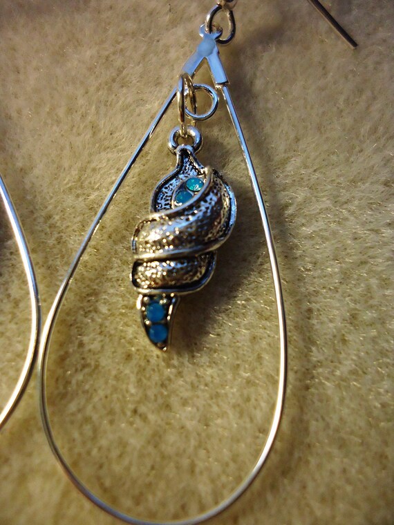 Items similar to Swarovski Shell Hoop Earrings on Etsy