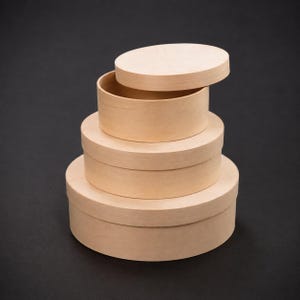May include: Four unfinished, round wooden boxes in a stack, with lids. The boxes are light brown and of varying sizes, with the smallest box's lid ajar. The boxes are arranged on a dark background.