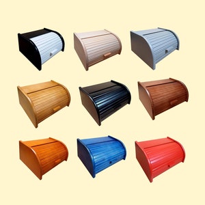 May include: Nine different coloured bread bins with a roll-top lid. The bread bins are made of wood and have a variety of colours, including natural wood, black, white, red, blue, and brown.