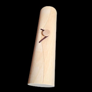May include: A cylindrical wooden box with a light brown finish and a small wooden knob on the top. A brown cord is tied around the knob.