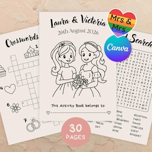 Op de afbeelding: Een trouwactiviteitenboek met de namen "Laura & Victoria" en de datum "26 augustus 2026" op de omslag. De omslag toont illustraties van twee bruiden die bloemen vasthouden. Het boek bevat kruiswoordraadsels en woordzoekers.