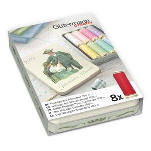 May include: A Gütermann Nostalgie Box with a vintage design, containing spools of thread in various pastel colours. The box includes a red spool of thread and the text "8x". The box also has the text "Gütermann creativ".