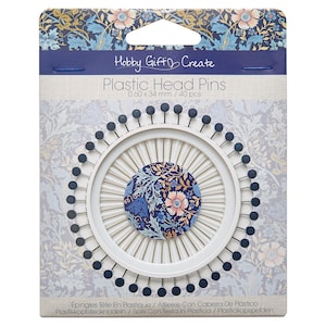 May include: A pack of Hobby Gift Create plastic head pins. The pins are arranged in a circular pattern with a floral design in the centre. Each pin is 0.60 mm x 34 mm. The package contains 40 pins.