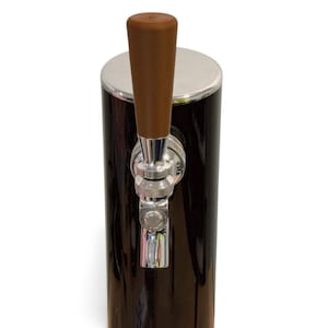 May include: A black and silver beer tap with a brown wooden handle. The tap has a shiny chrome finish and is designed for dispensing beverages. The tap is cylindrical and has a polished appearance.