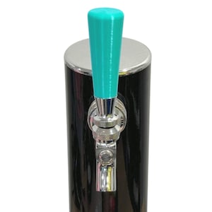 May include: A black beer tap with a teal handle. The tap has a shiny chrome finish on the spout and the base of the handle. The tap is cylindrical and has a silver top.