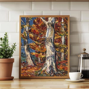 May include: A framed landscape painting depicts a forest scene with tall, white-barked trees and vibrant autumn foliage in shades of orange, red, and yellow. The artwork is set against a blue sky, creating a contrast of colors. The painting is in a wooden frame.