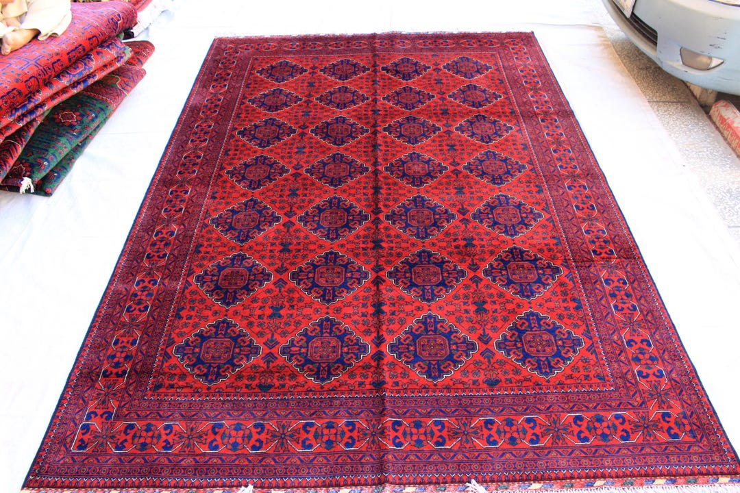 大きな赤いアフガニスタンウールラグ：7 x 10フィートの手作り