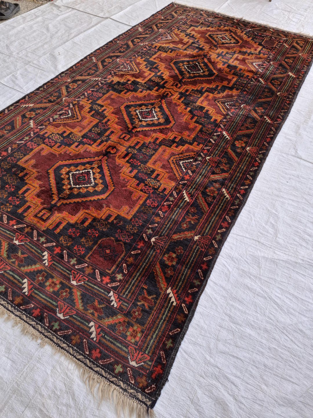Handmade Orange-black Baloch Rug: Afghan Tribal Wool Rug (8.92 X