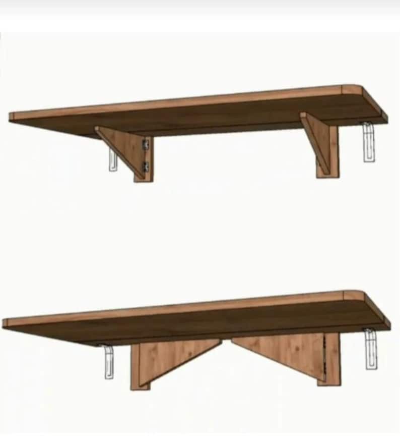 May include: Two wooden folding shelves with metal brackets. The shelves are brown and the brackets are silver. The shelves are mounted to a wall.