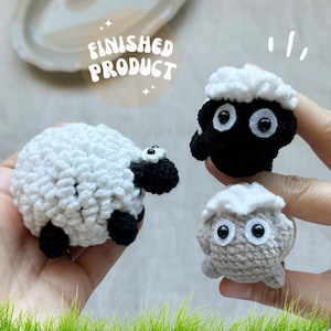 May include: Crocheted sheep toys in white, black, and gray. The toys have fluffy white wool and black faces, legs, and ears. The text "FINISHED PRODUCT" is in a circle above the toys.