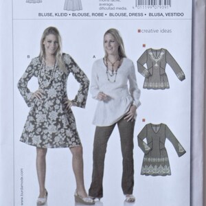 May include: A sewing pattern for a blouse or dress with a floral print. The pattern is from Burda style magazine and is number 7939. The pattern is for sizes 8 to 20.