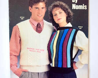 May include: A vintage knitting pattern booklet for vests, featuring a white vest with a cable knit design and a multi-colored striped vest. The booklet is titled "VESTS by Nomis" and includes the text "For Men, Women, and Children Sizes 26-44".