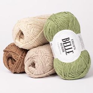 May include: A collection of yarn skeins in various colors, including beige, brown, and green. One skein has a label that reads "DROPS BELLE". The yarn appears to be soft and suitable for knitting or crocheting projects. The skeins are stacked together.