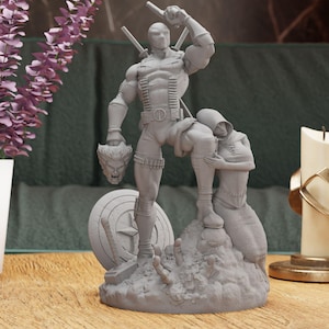 May include: A gray 3D printed figurine of Deadpool holding a severed head and standing on a base with a Captain America shield, a hammer, and other details.