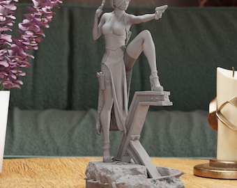 May include: A grey 3D printed figurine of a woman holding two guns, standing on a broken metal beam and a rocky base.