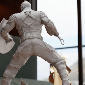 a statue of a man in a white suit