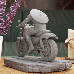 a statue of a person riding a motorcycle on a table