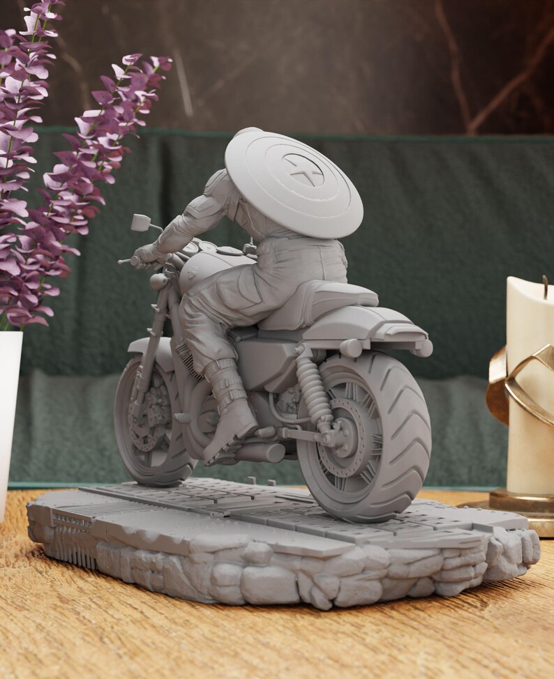 a statue of a person riding a motorcycle on a table