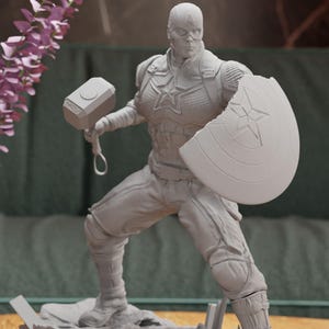 a statue of a man with a hammer and shield