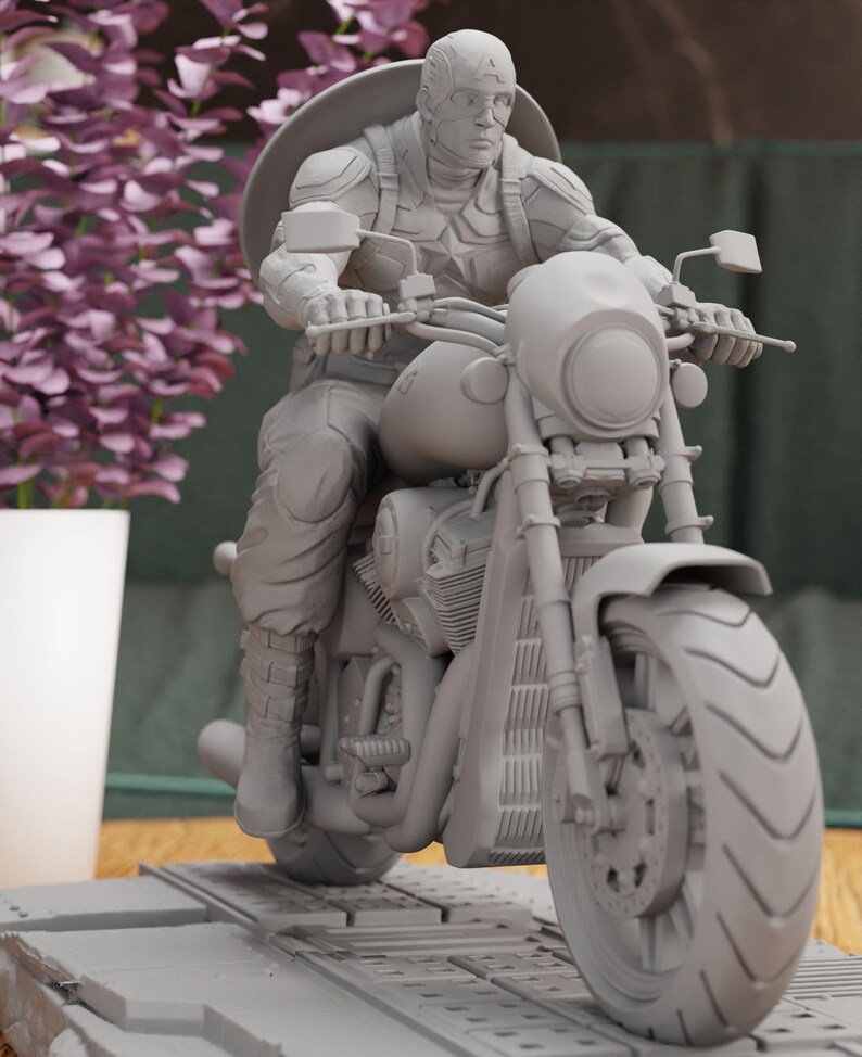 a statue of a man riding a motorcycle