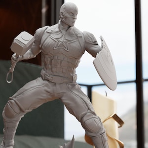 a statue of a man holding a shield