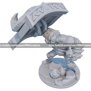 a statue of a man holding a giant sword