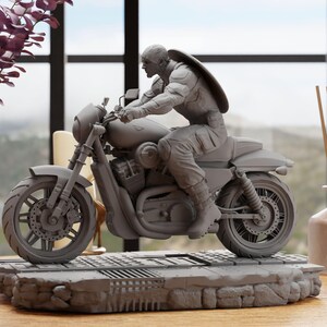 a statue of a man riding a motorcycle