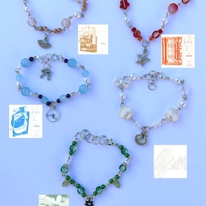 May include: Five beaded bracelets with different charms. The bracelets are made with various colours of beads, including white, blue, green, red, and pink. The charms include a fan, a wave, a starfish, a seashell, and a star.