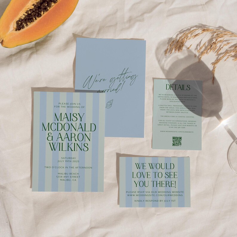 May include: A wedding invitation suite with blue and green stripes. The invitation features the names "Maisy McDonald & Aaron Wilkins" and the wedding date "July 19th 2025". The RSVP card says "We would love to see you there!" and includes the website address "www.wedoingsite.com/ourwedding".
