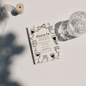 A whimsical 5x7 invitation card for a 2025 New Year's Eve party. The design features hand drawn illustrations of hands holding drinks up to toast. The theme is "Cheers to 2025" with a bow on top.