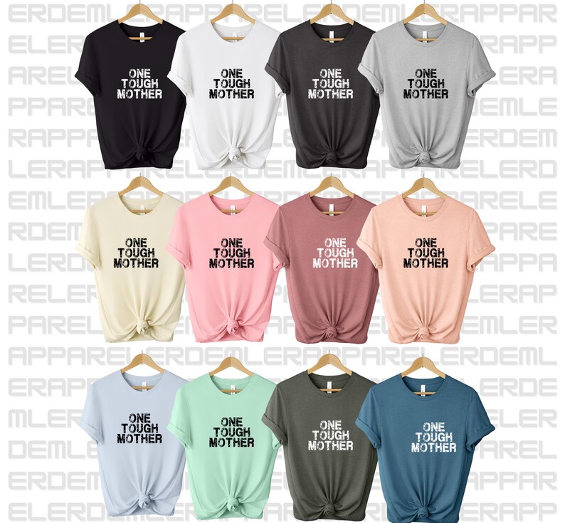 May include: Nine t-shirts in different colors with the text "One Tough Mother" printed in black on the front.