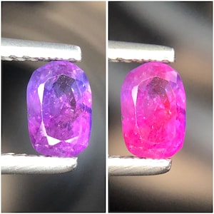 May include: A faceted cushion-cut gemstone held by metal tweezers. The left side shows the stone in a deep purple hue, while the right side displays the same gemstone in a vibrant, saturated pink colour, highlighting its colour-changing properties.