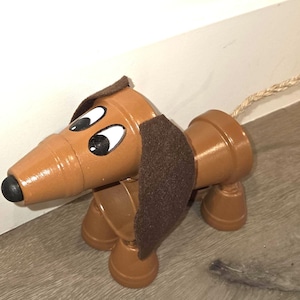 Terracotta Pot Dachshund: Whimsical Dog Sculpture