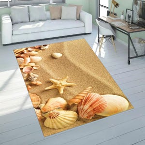 May include: A rectangular rug depicting a beach scene with seashells and a starfish on a sandy background. The rug is light brown with detailed imagery of various seashells in white, tan, and orange. The rug is designed to resemble a sandy beach, bringing a coastal theme.