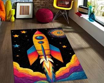 Alfombra infantil Rocket: lavable y antideslizante, con temática espacial y de estrellas.