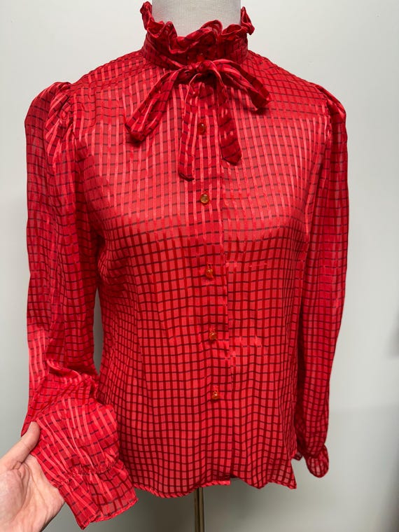red sheer blouse