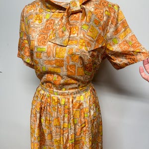 Vintage 50s blouse and skirt set light weight silky feel beautiful bright tangerine and like tiki print