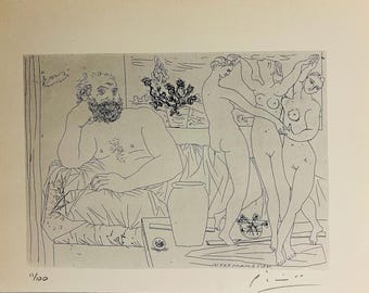 May include: Black and white print of a seated man and three dancing figures. The seated man has a beard and is resting his head on his hand. The three figures are nude. A vase and a plant are also visible.